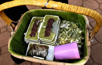 a basket with Sinukmani and other delicacies of a kakanin vendor.