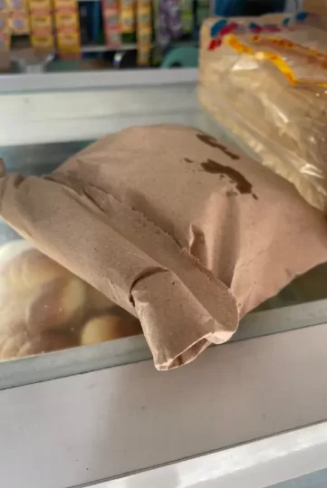 Freshly baked Bonete in a paper bag