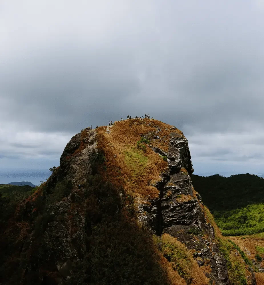 Mountain climbers on peak of Mount Batulao